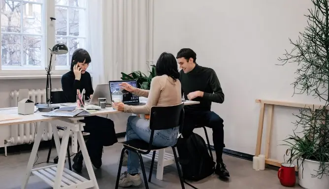 Person working on a laptop with the Notion app open.
